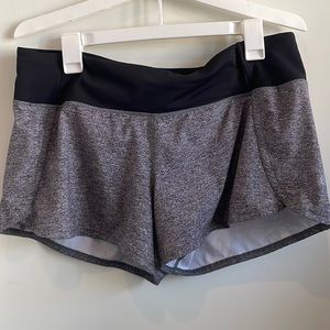 Gray Lululemon 2.5in Hotty Hot shorts with black waistband.